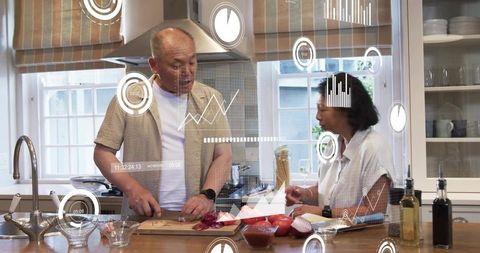 Mature couple chopping vegetables with digital hud overlays in modern kitchen