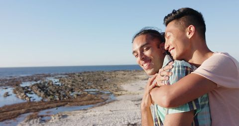 Diverse Gay Couple Embracing at Scenic Seaside - Download Free Stock Images Pikwizard.com