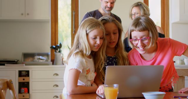 Family Enjoying Time Together on Laptop at Home - Download Free Stock Images Pikwizard.com