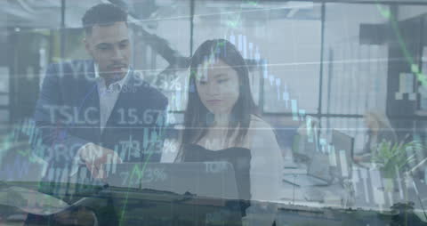 Business Team Analyzing Stock Market Trends with Technology