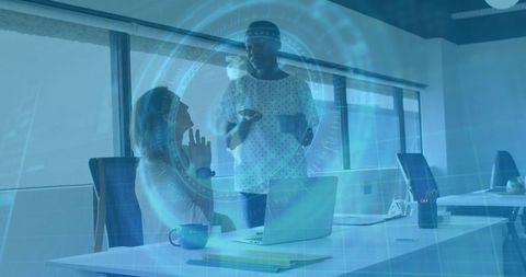 Women Collaborating in Modern Office with Tech Overlays