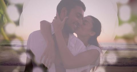 Diverse Couple Embracing at Sunset on Beach
