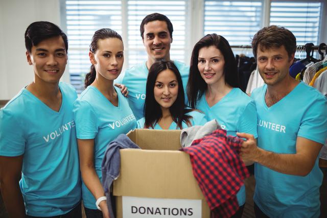 Group of volunteers with donation box - Download Free Stock Photos Pikwizard.com