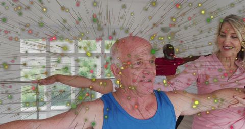 Senior man stretching in group fitness class with particle overlay and balance practice