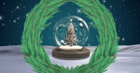 Christmas Wreath Over Snow Globe in Winter Wonderland Scene