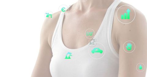 Mid-adult woman wearing white tank top with teal sustainability, energy and analytics icons overlay