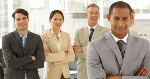 Confident Businessman Leading Diverse Team in Office - Download Free Stock Images Pikwizard.com