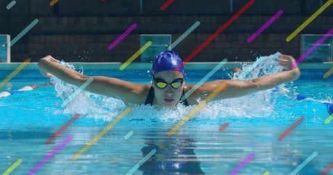 Swimmer performing butterfly stroke with colorful overlay in pool