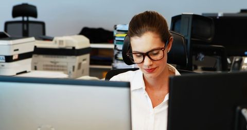 Young Woman Engaged in Work in Contemporary Office Setting - Download Free Stock Images Pikwizard.com