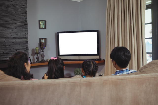 Family Watching Television with Transparent Screen, Rear View at Home - Download Free Stock Videos Pikwizard.com