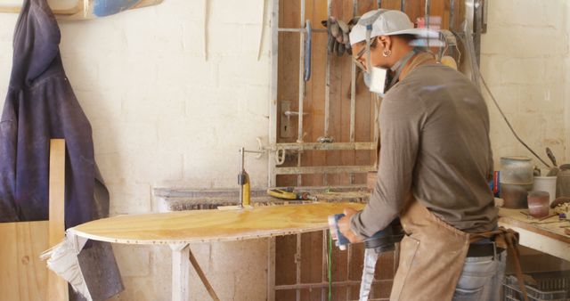 Skilled Craftsman Sanding Surfboard in Workshop - Download Free Stock Images Pikwizard.com