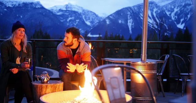 Couple Enjoying Evening by Fire Pit in Mountain Retreat - Download Free Stock Images Pikwizard.com