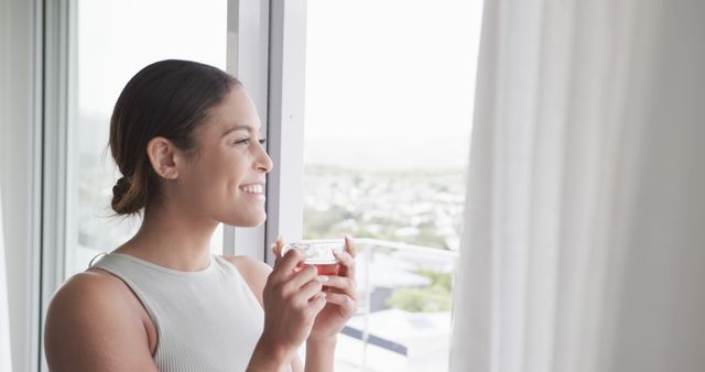 Woman Enjoying Morning Coffee Looking Out Window Reflecting Happiness - Download Free Stock Images Pikwizard.com