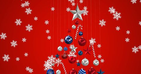 Festive Christmas Tree with Ornaments and Falling Snowflakes on Red Background
