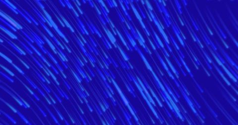 Vibrant blue light trails in dynamic patterns
