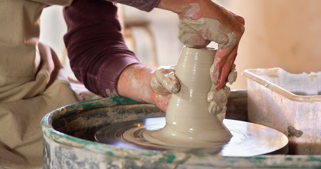 Close-up Hands Shaping Pottery on Spinning Clay Wheel - Download Free Stock Images Pikwizard.com