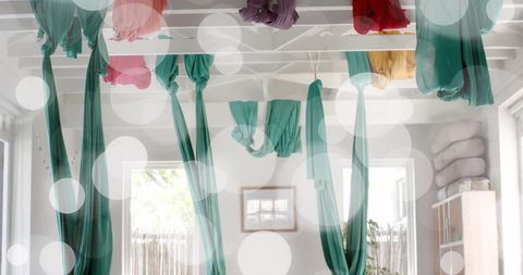 Bright aerial yoga room with floaty fabric swaths