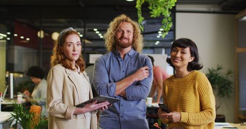 Smiling diverse business team in modern office environment