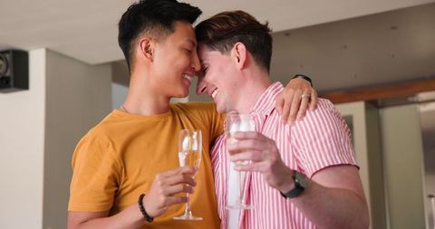Romantic Diverse Couple Joyfully Toasting with Champagne