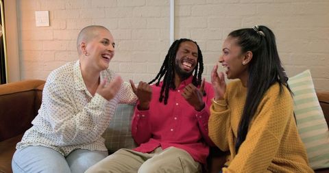 Diverse Friends Laughing on Sofa, Casual Conversation and Joyful Bonding in Cozy Living Room