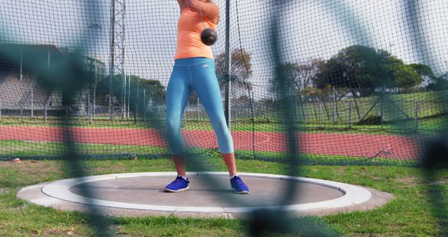 Female Athlete Practicing Hammer Throw in Sports Ground - Download Free Stock Images Pikwizard.com