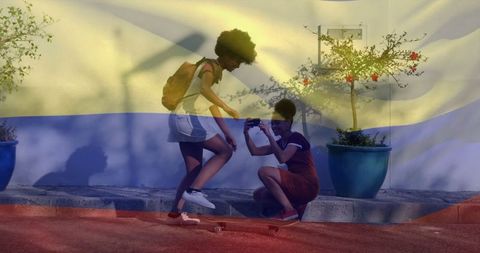 Friends Filming Skateboarding Adventure on Sunlit Street