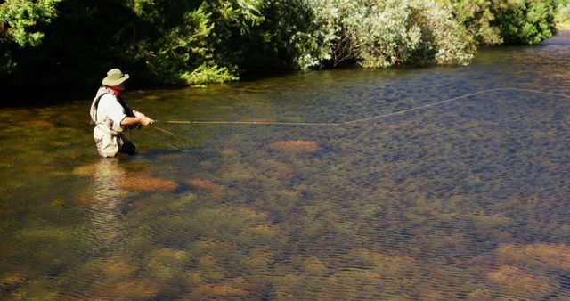 Man Fly Fishing in Tranquil River with Copy Space - Download Free Stock Images Pikwizard.com