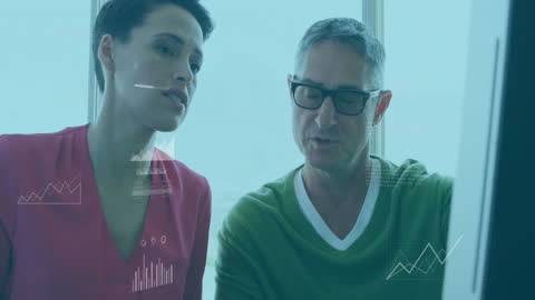 Diverse Professionals Analyzing Financial Data on Computer