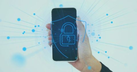 Female hand holding smartphone with holographic padlock shield protecting mobile data