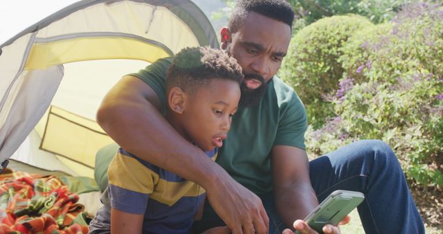 Father and Son Camping Outdoors and Using Smartphone - Download Free Stock Images Pikwizard.com