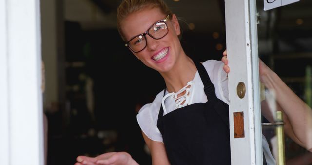 Friendly Barista Welcoming Customers at Cafe Entrance - Download Free Stock Images Pikwizard.com