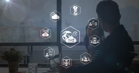 Digital Network Icons Overlaying Business Discussion in Office Environment