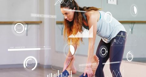 Barre instructor demonstrating stretch with AR fitness overlays and performance tracking