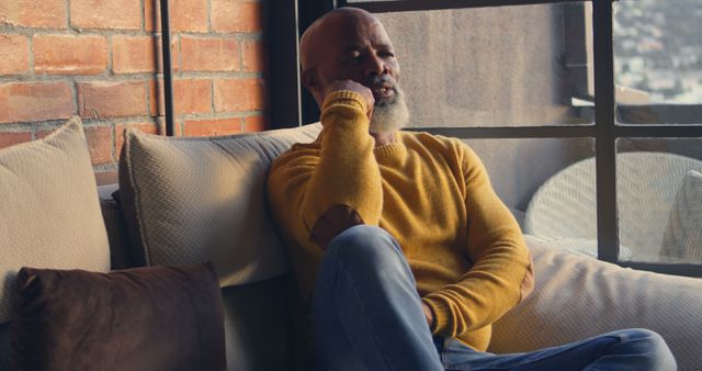 Senior Man Sitting on Couch Talking on Smartphone - Download Free Stock Images Pikwizard.com