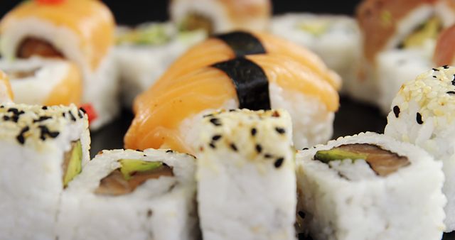 Close-Up of Assorted Sushi Rolls and Nigiri on Black Background - Download Free Stock Images Pikwizard.com