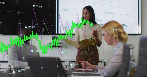 Diverse Business Team Analyzing Data Trends in Meeting