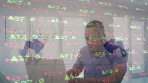 Analyzing Financial Data on Laptop in Modern Office