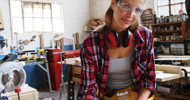 Confident female carpenter in workshop using tools - Download Free Stock Images Pikwizard.com