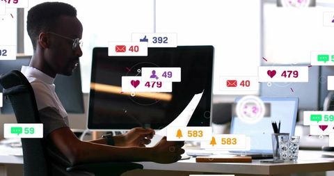 Marketing professional reviewing documents amid floating social notifications and alerts