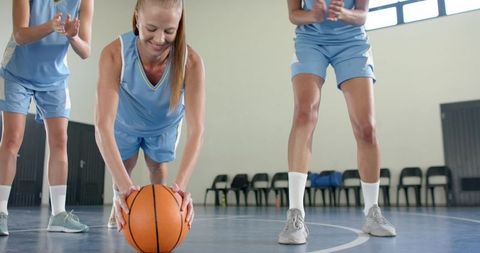 Female Teammates Engaging in Basketball Warm-Up Drill