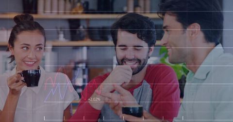 Three friends chatting over coffee in cozy cafe sharing phone, smiling with data overlay