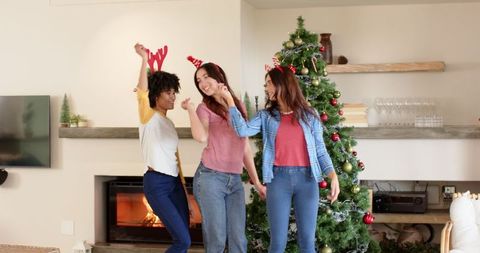 Diverse Friends Celebrating Christmas with Lively Dance Party