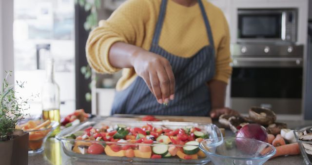 Person Preparing Fresh Vegetable Salad in Modern Kitchen - Download Free Stock Images Pikwizard.com