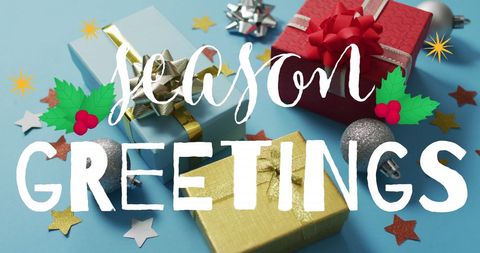 Season greetings with christmas decorations and gift boxes on blue background