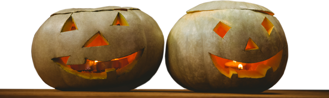 Two Transparent Jack-o'-Lanterns with Candles Glowing Inside on Table - Download Free Stock Videos Pikwizard.com