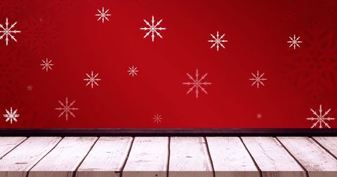 Snowflakes on red background with wooden floor