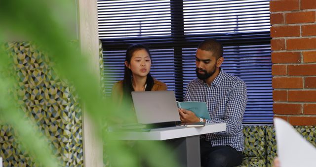 Young Professionals Collaborating in Modern Office with Plants and Brick Wall - Download Free Stock Images Pikwizard.com