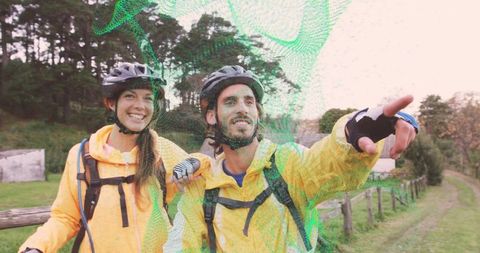 Couple in yellow jackets planning adventure journey together