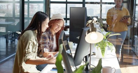 Diverse Coworkers Engaged in Collaborative Office Work