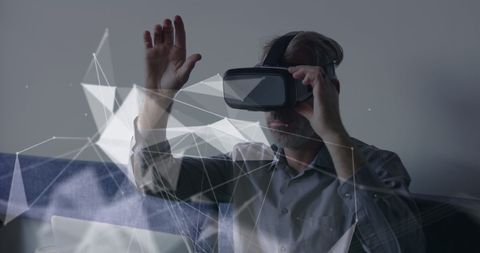 Businessman Using VR Headset with Futuristic Data Overlays - Download Free Stock Images Pikwizard.com